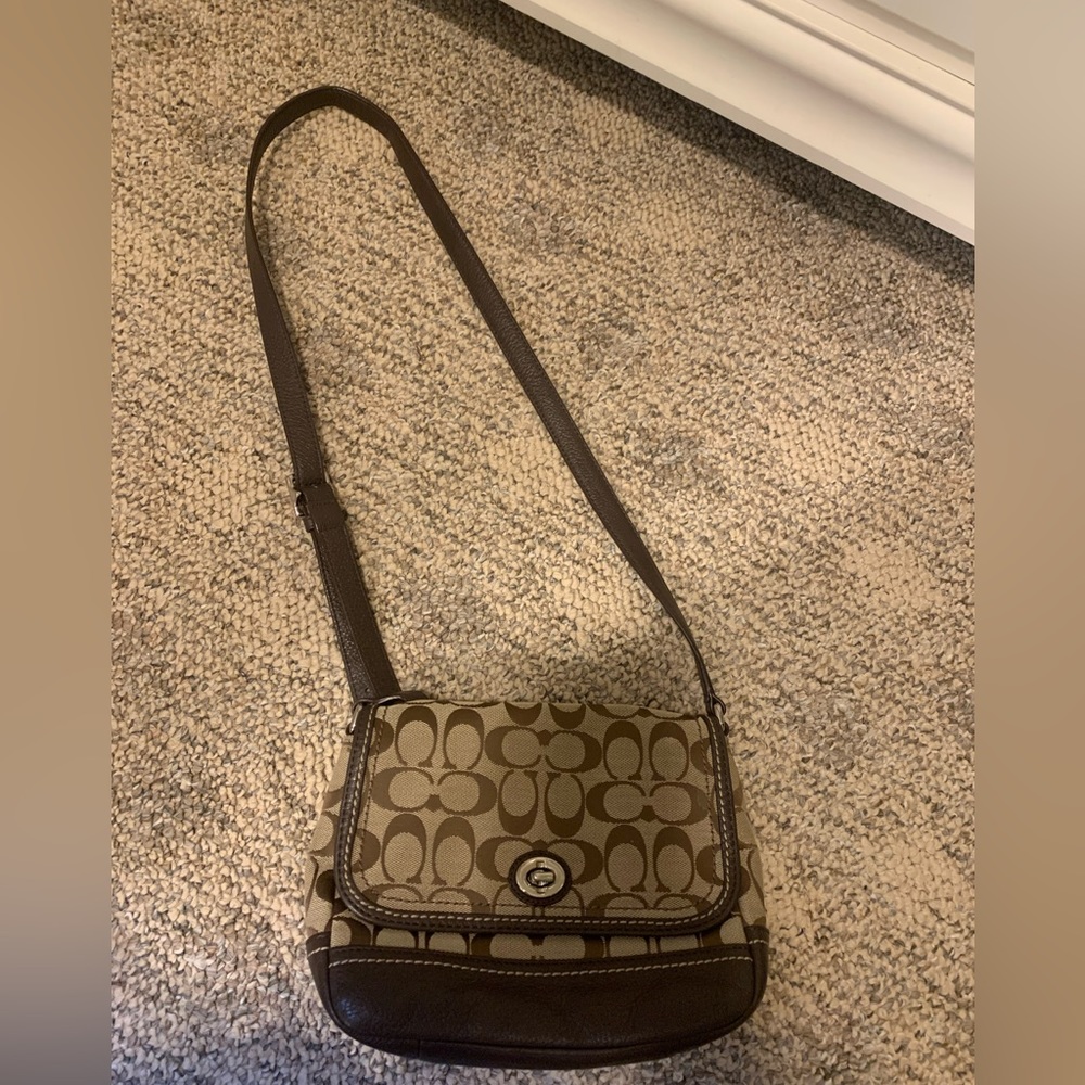 Traditional pattern coach crossbody